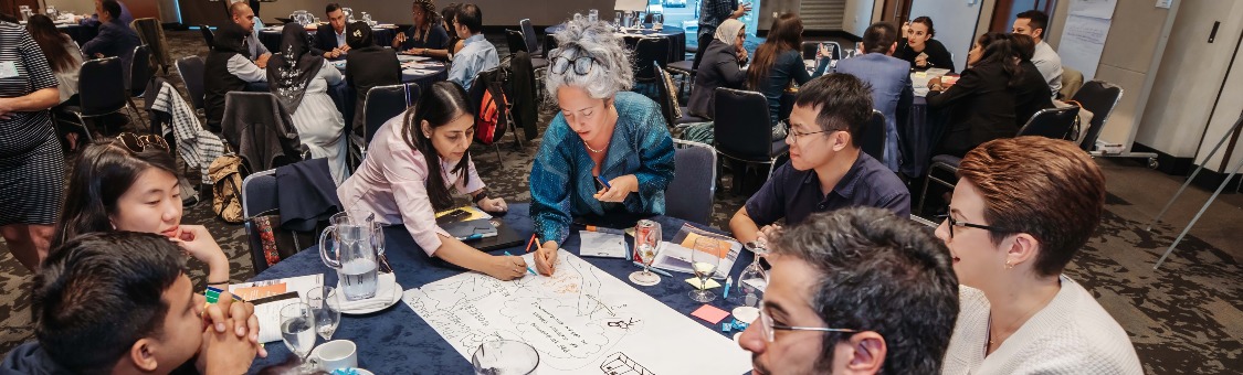 Participants collaborating during the symposium.