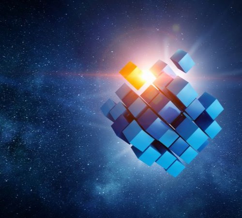 A cube in space symbolising quantum technology. Part of the cube is glowing.