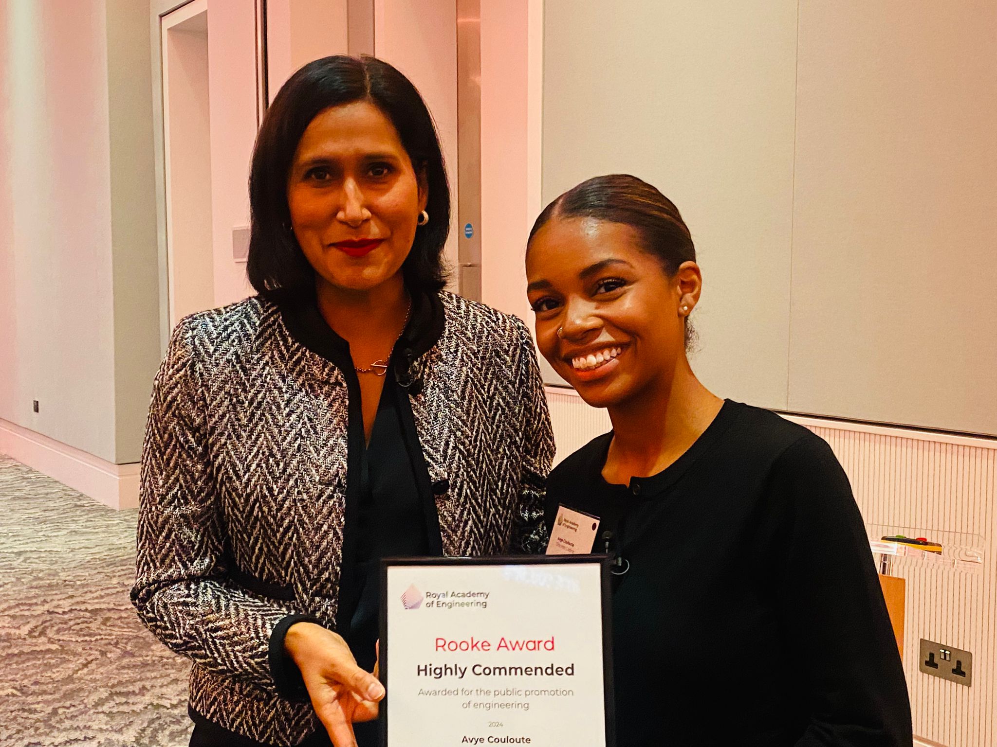 Avye Couloute (right) receives the Rooke Award highly commended certificate on 24 September 2024 from Academy CEO Dr Hayaatun Sillem CBE.