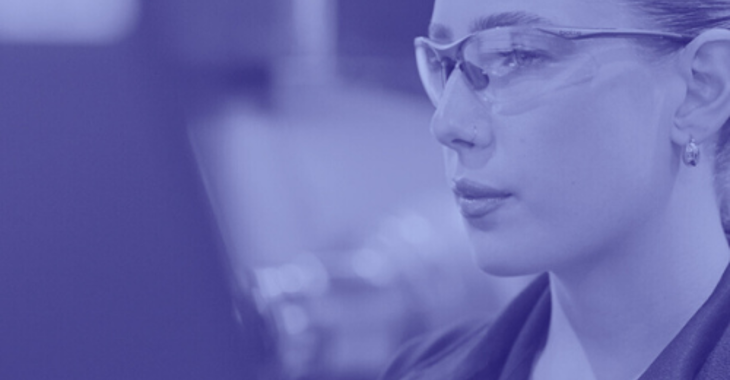 Female technician programming CNC