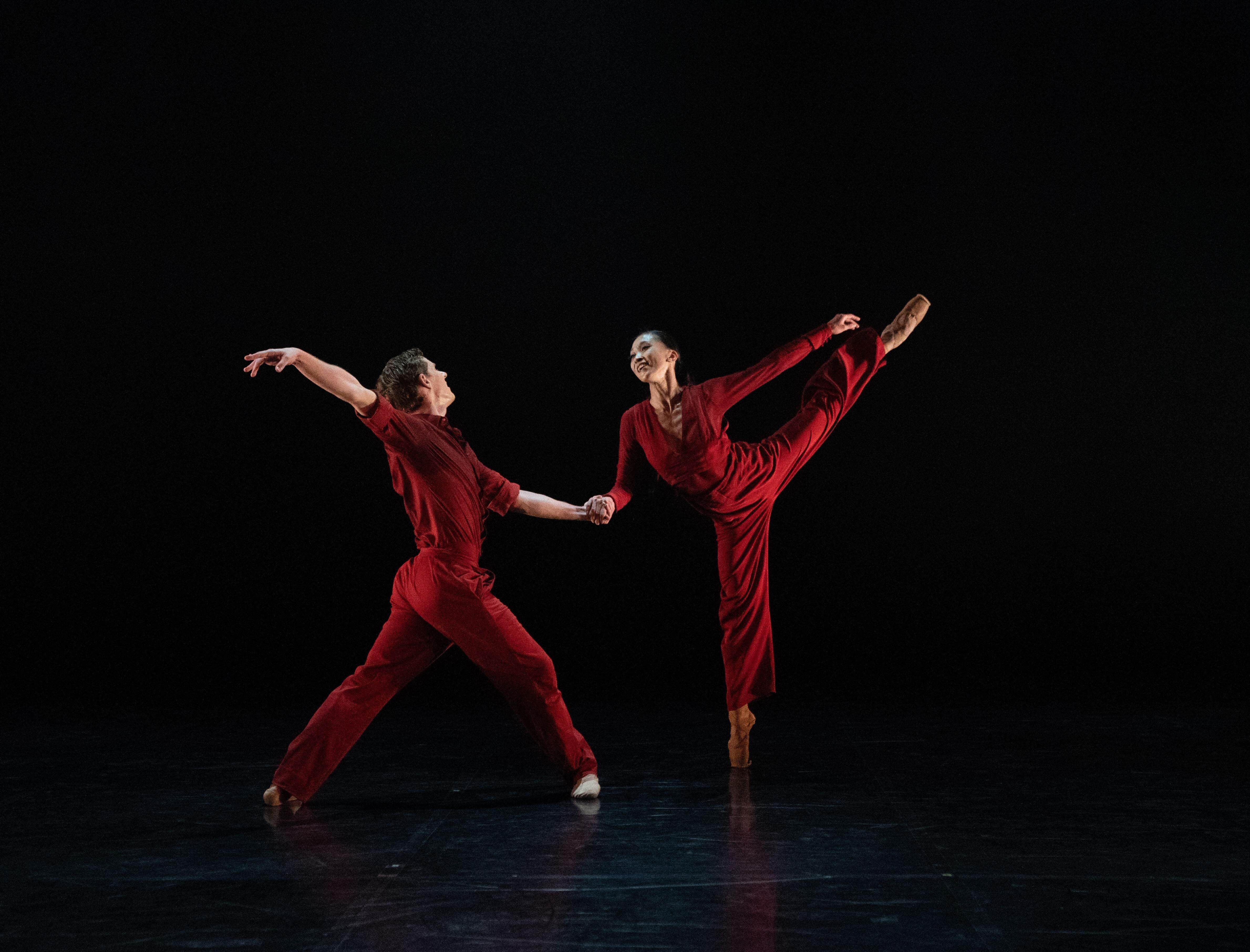 Picture of 2 ballet dancers wearing red overalls