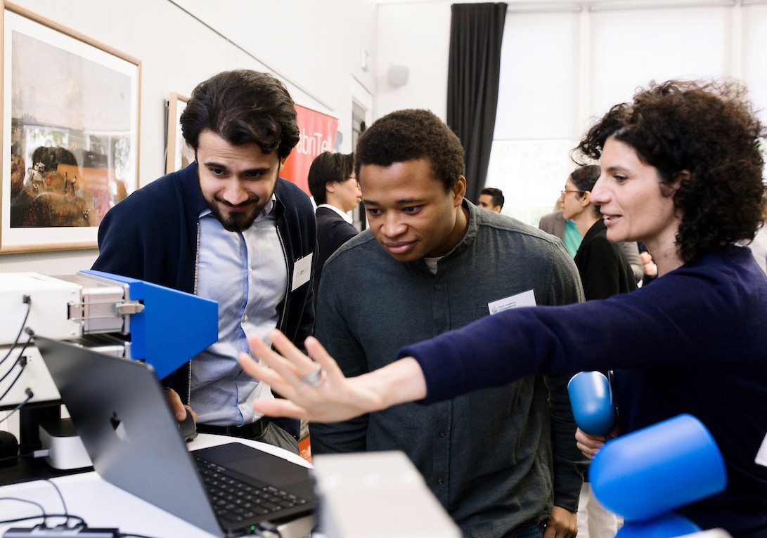 Young engineers using a laptop at the Academy