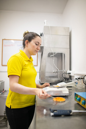 Photo of Maria working with Grinsup in a lab.