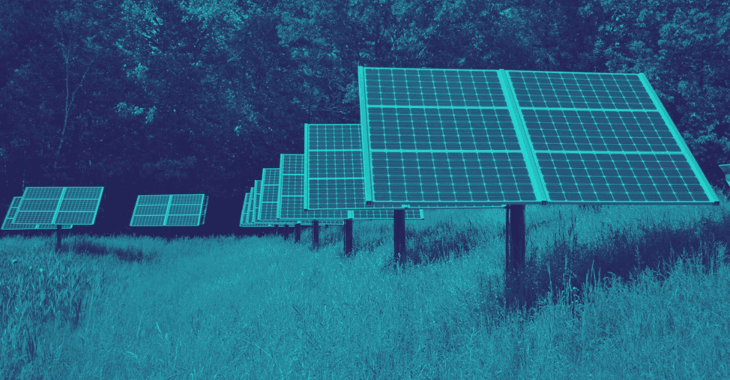 Blue duochrome image of a solar farm in a field