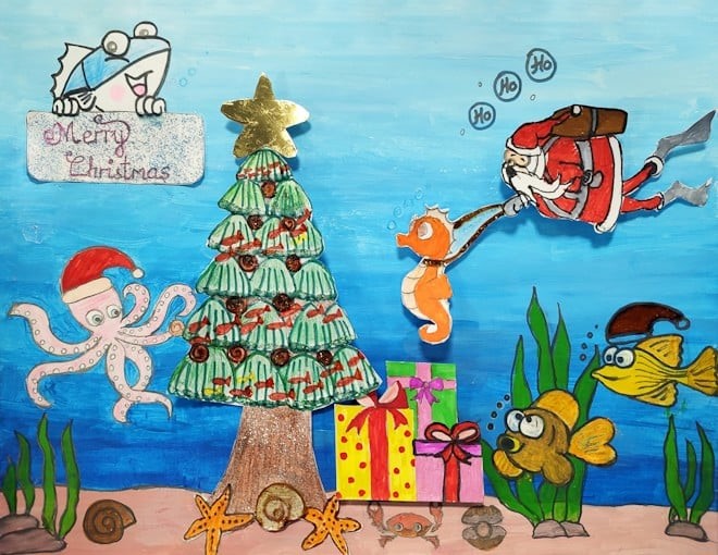 winning entry featuring underwater scene with Christmas tree, octopus, fish, presents and scuba diving Santa with a seahorse sleigh