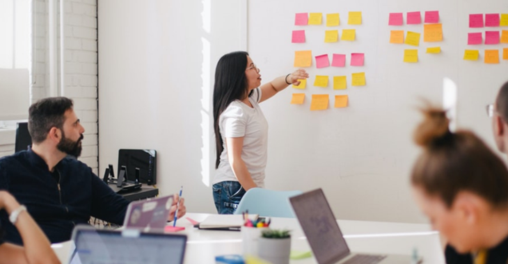 Blog Banner DORA People In Group Talking Around A Whiteboard 1240X520