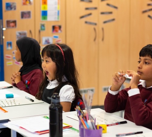 Students in a classroom during one of the activities