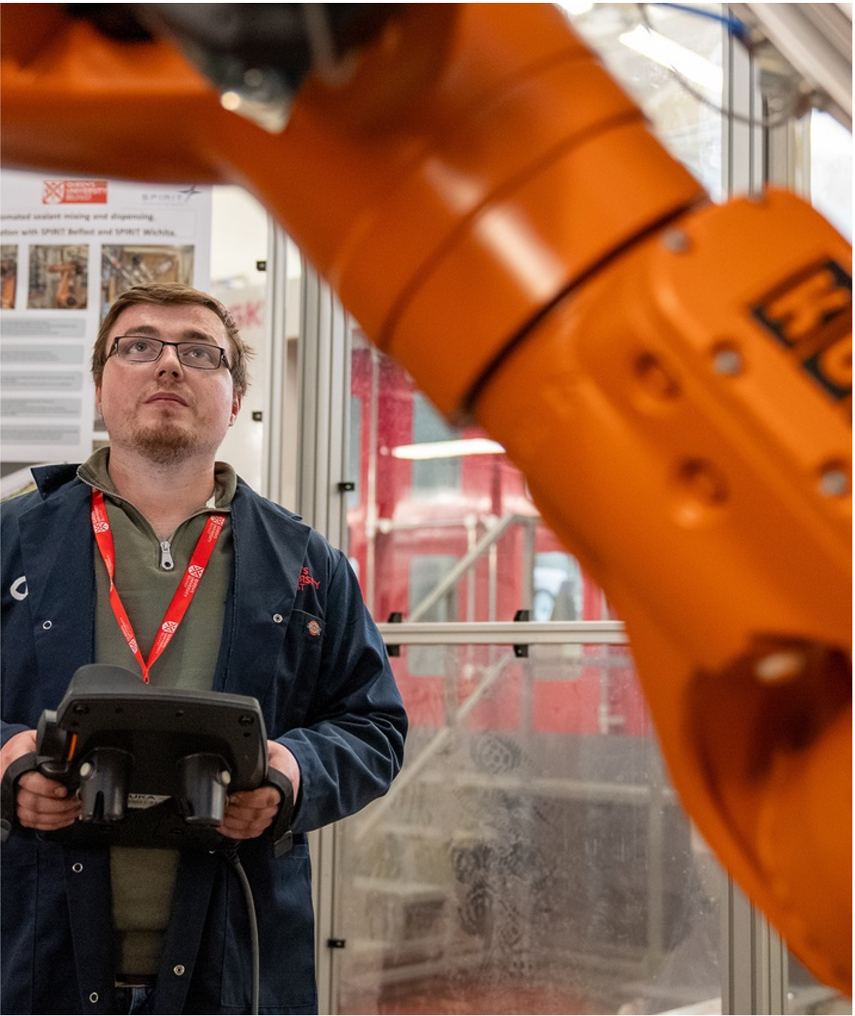 Ryan, a staff member, with a robot