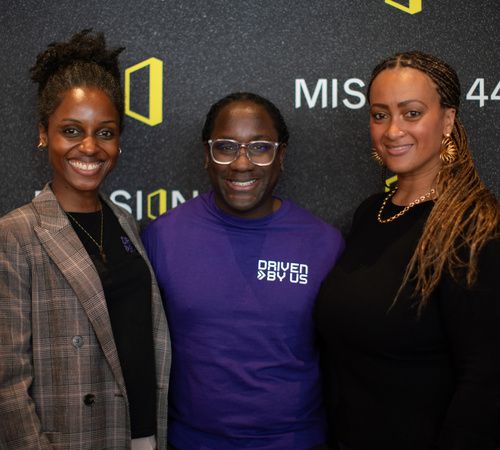 Three people posing for a photo at the Motorsport Scholarship Launch event
