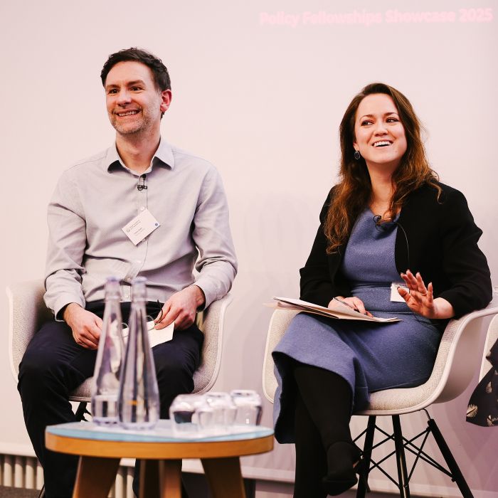 Policy Fellows alumni Chris Irwin and Simone Cooper-Searle speaking as panellists at the Policy Showcase